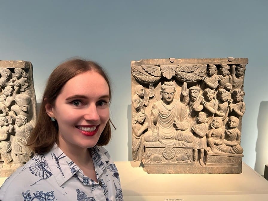 Ashley Crawford with a Gandharan frieze of the Buddha delivering the first sermon.