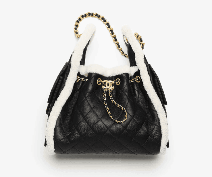 Chanel 25 Small Handbag in black crumpled shearling sheepskin and gold-tone metal.
