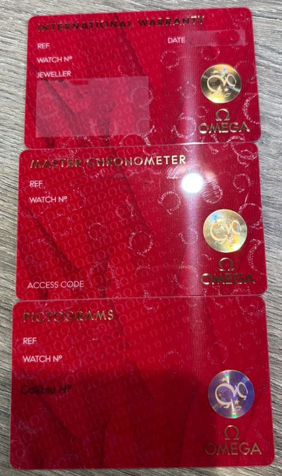 Omega Watch - Warranty Card, Master Chronometer and Pictograms cards.