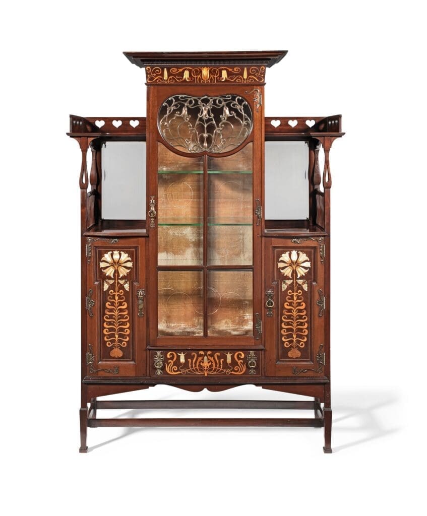 Shapland & Petter of Barnstaple. ‘Lily’ design inlaid mahogany display cabinet, circa 1900. Sold for £2,560 in 2023. Photo courtesy of Bonhams.